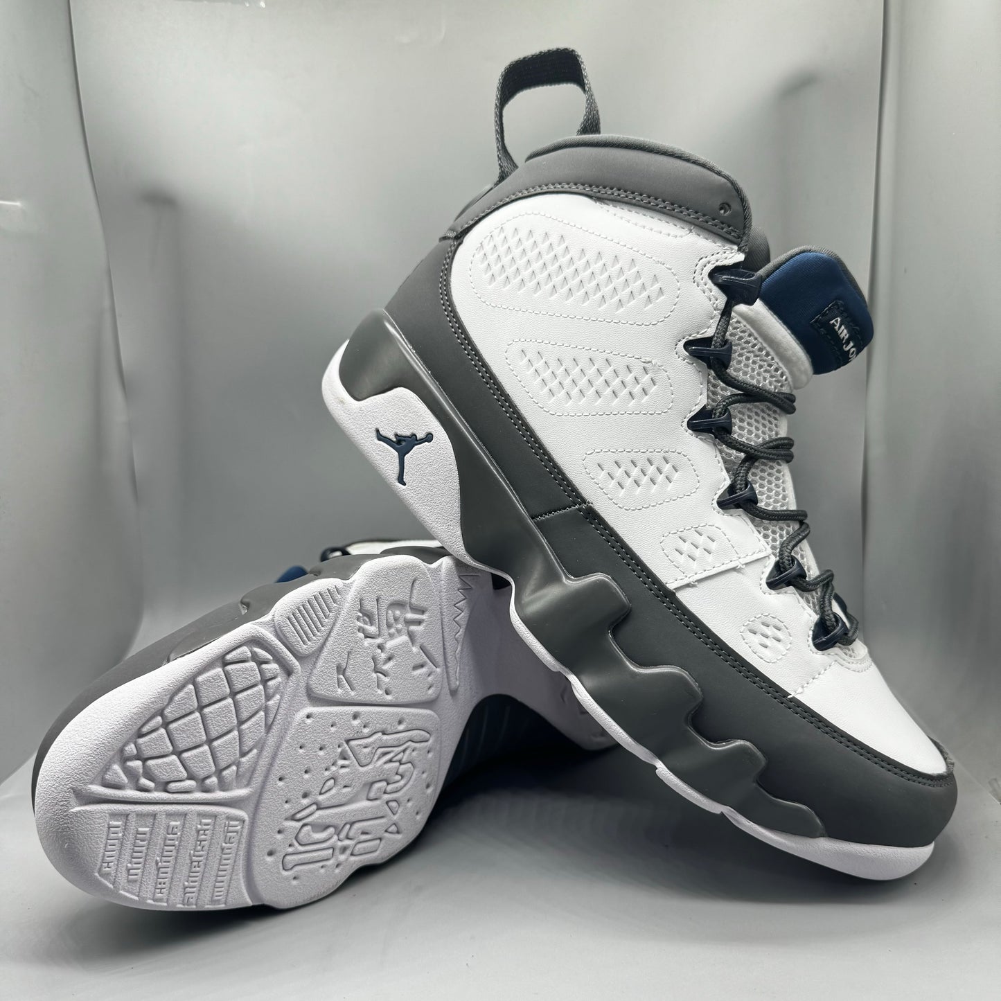 Air Jordan 9 Retro "Flint Grey" sneakers with white, French blue, and Flint grey colors