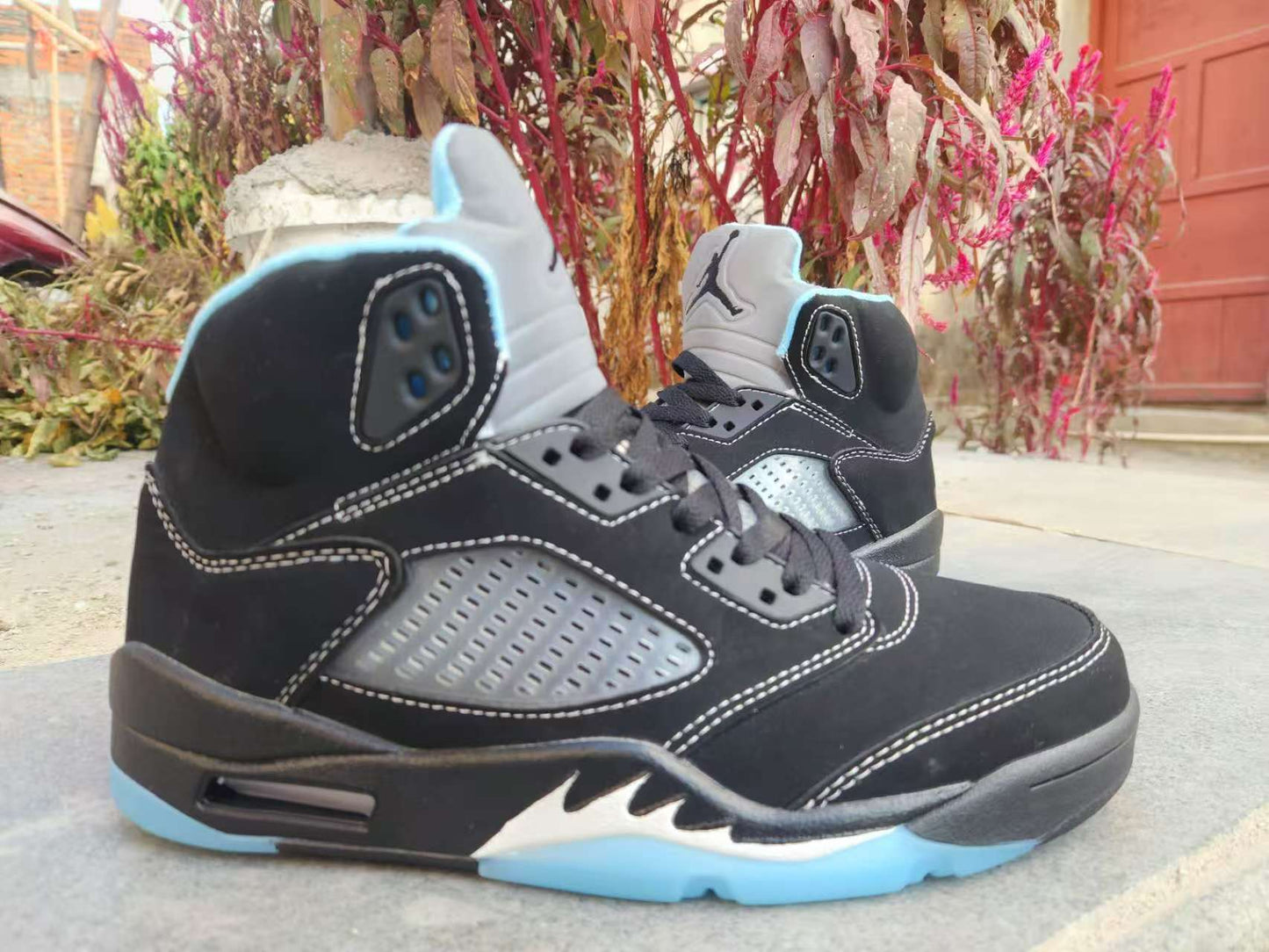 Air Jordan 5 Retro LS sneaker in the "Black/University Blue"