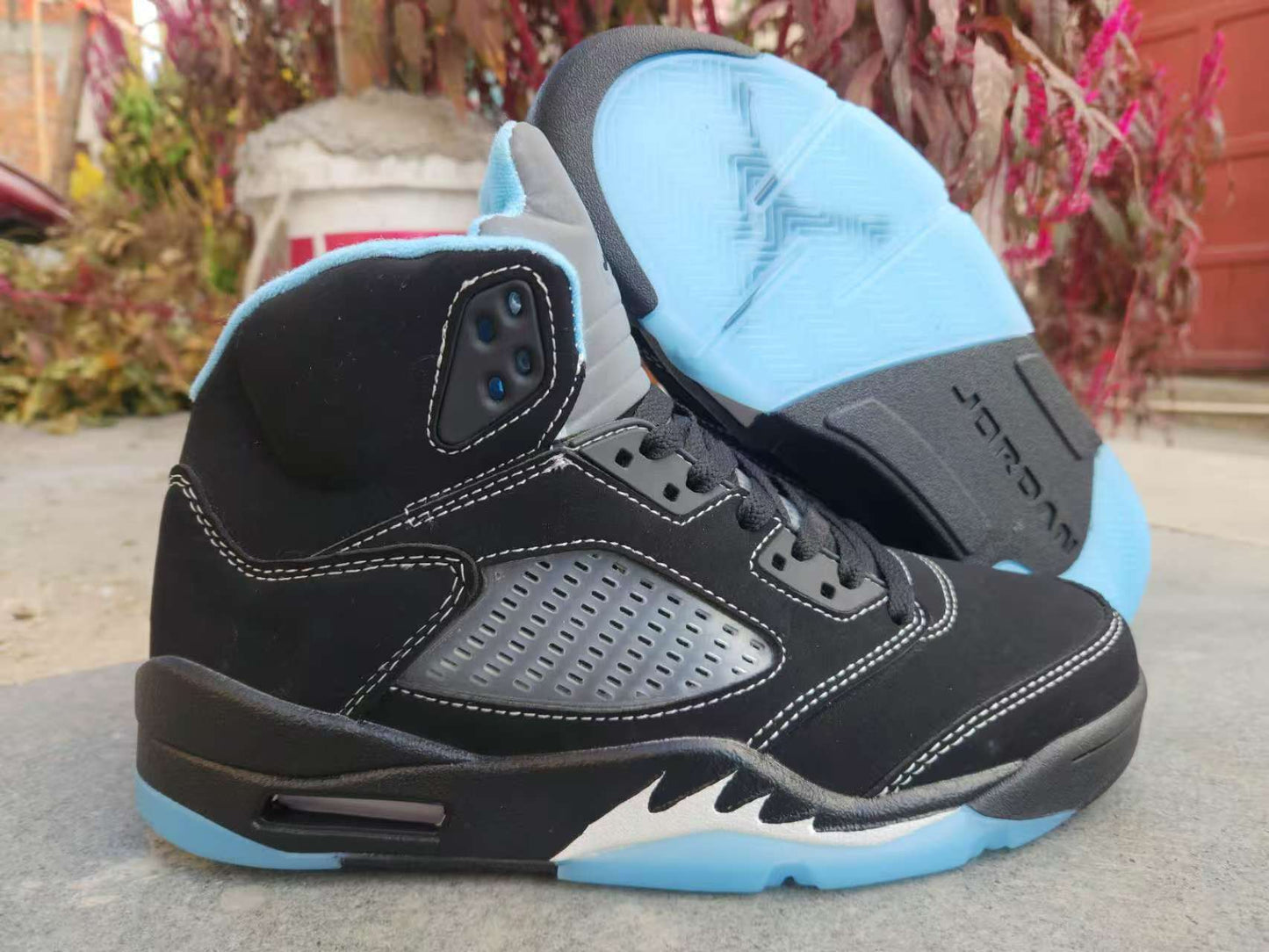 Air Jordan 5 Retro LS sneaker in the "Black/University Blue"