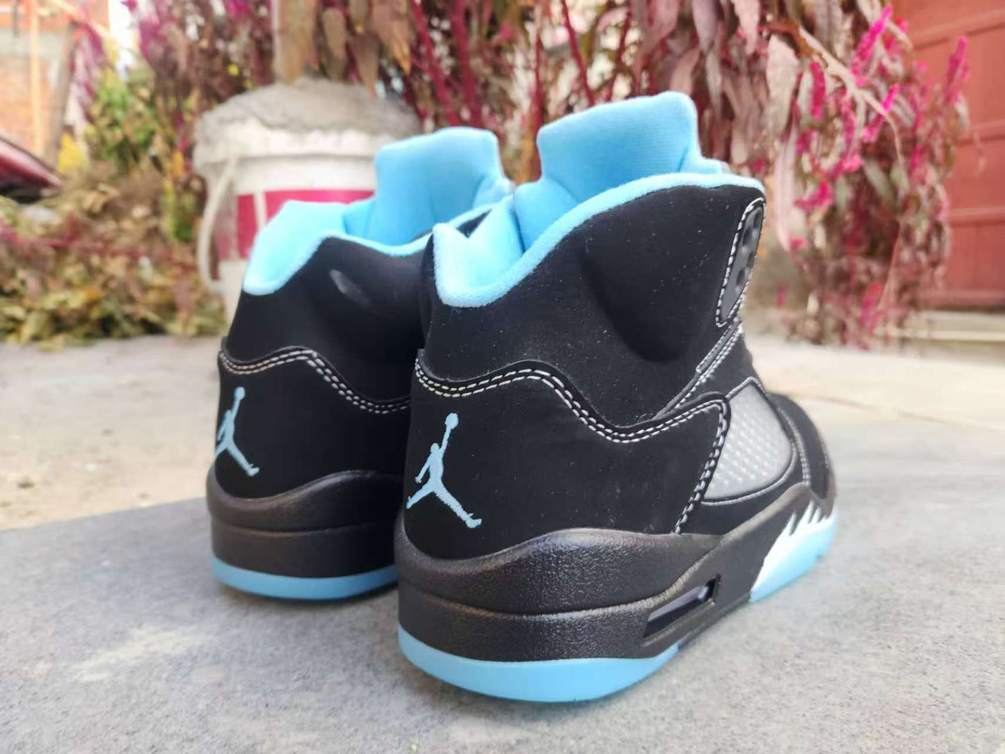 Air Jordan 5 Retro LS sneaker in the "Black/University Blue"
